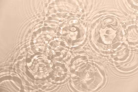 Rippled beige water surface background Stock Photos