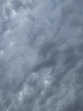 Rippled Gray Cloud Pattern Across Overcast Sky Stock Photos