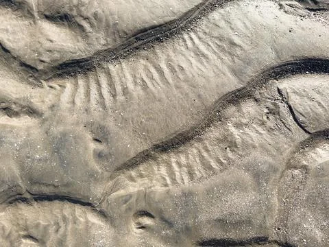 Rippled mud sand background Stock Photos