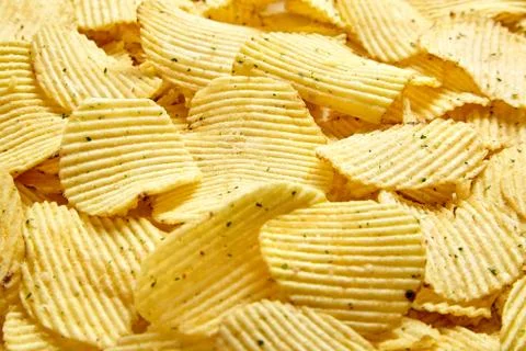 Rippled potato chips with condiment Stock Photos