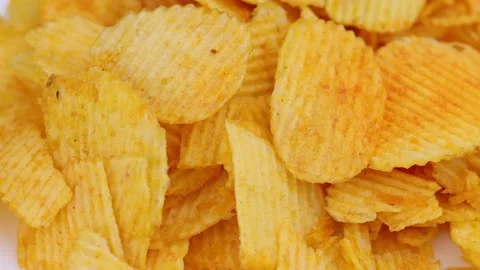 The rippled potato chips rotate around. Stock Footage 219211490