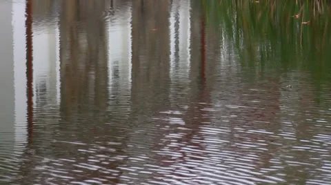 Rippled water background with white building reflection Vídeos de archivo 35409255