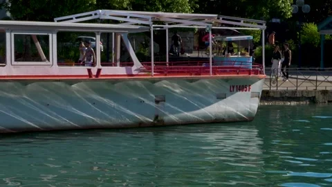 Rippled water reflecting sunrays on side of boat and creating light effects Stock Footage 157007637