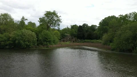 Rippled water surface on pond by old remains of old building Stock-Footage 155821031