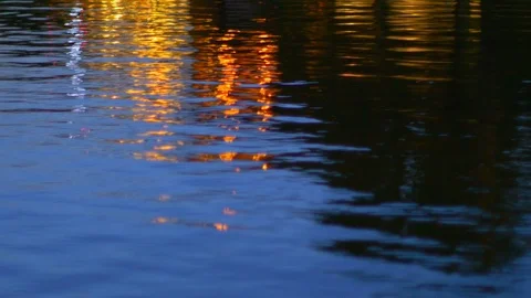 Rippled water surface, reflection of light at night. Abstract background. Stock Footage 96571206