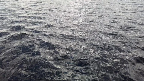 Ripples and cloud reflections on the lake surface Stock Footage 129731722