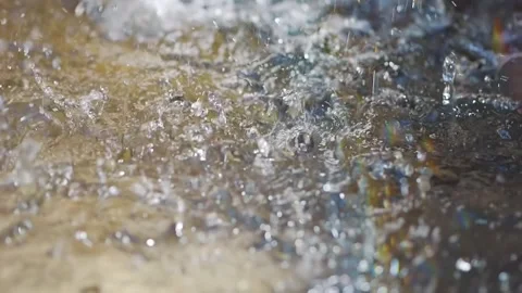 Ripples and drops splashing on a surface of water in slow motion 300fps Stock Footage 286114301