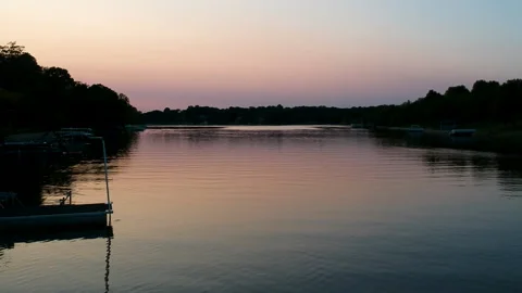 Ripples and Sunset Reflection on a Summer Lake Stock Footage 145241940