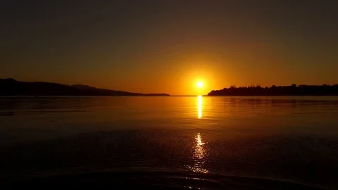 Ripples at foreground on ocean at sunset Video stock 107447631