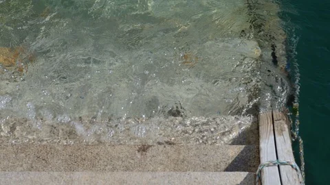 Ripples on the harbour steps Stock Footage 112306868