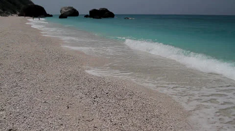 Ripples lave a shingle beach at the coast of Ionian sea Stock Footage 25998415