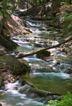 Ripples on mountain river Stock Photos