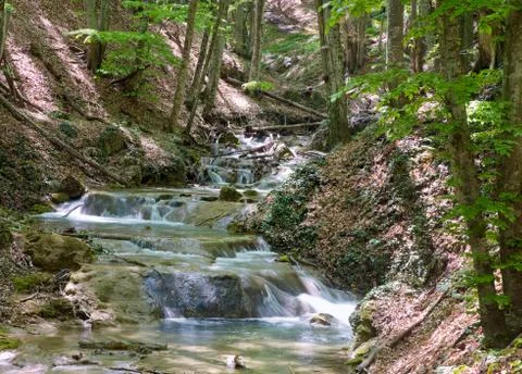 Ripples on mountain river Stock Photos