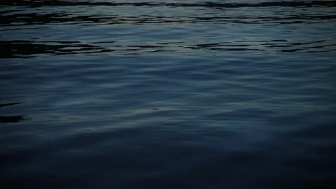 Ripples on the sea surface at night Stock Footage 238081739
