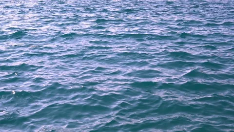Ripples on the surface of the blue sea Stock Footage 99531613
