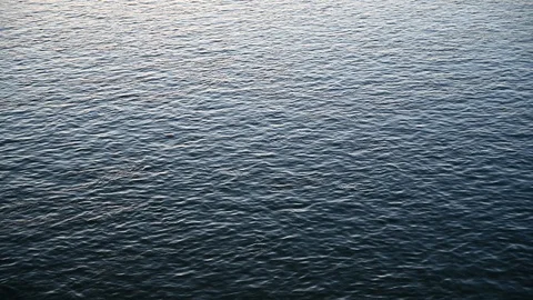 Ripples on a the surface of a calm river Stock Footage 120267166