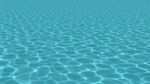 Ripples on the surface of a swimming pool or tropical sea from diagonally above Stock Footage 306114261