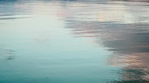 Ripples on the water with a beautiful reflection of blue sky and clouds Stock Footage 220791982