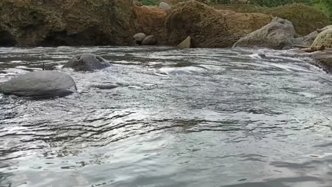 Ripples of water flowing between the rocks Stock Footage 237014407
