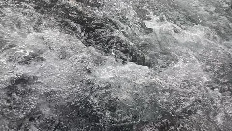 Ripples of water flowing between the rocks Stock Footage 237016579