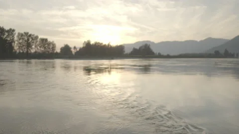 Ripples on Water Pan Up Sunset Stock Footage 164325812