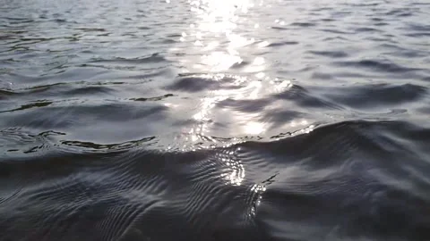 Ripples in the water at sunset. unfocused Stock Footage 221564634