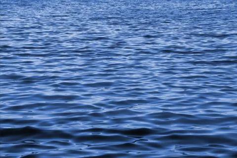 Ripples on water surface to infinity as background Stock Photos
