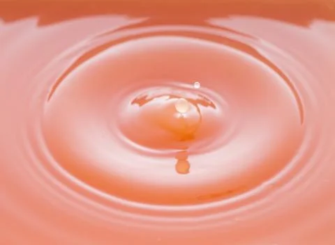 Rippling after a few drops of grapefruit juice. Stock Photos