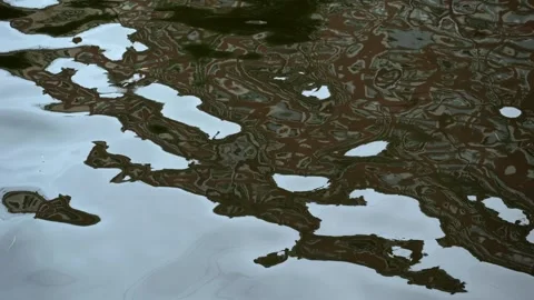 Rippling city river surface with abstract reflection of building Stock Footage 289563967