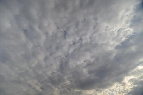 Rippling clouds form quilted texture of soft undulating shapes and subtle s.. Stock Photos