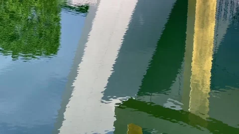 Rippling pool reflection of a geometric resort sculpture Stock Footage 282532331
