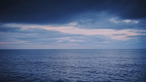 Rippling Sea Water Under The Dramatic Sky In Dunstanburgh, England - Wide Stock Footage 127097866