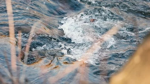 Rippling water flows gently over rocks Stock Footage 304648527
