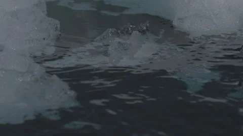 Rippling Water Moves Through Bits of Ice 1 Stock Footage 292941459