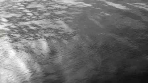 Rippling water surface with light reflections, black and white. 4K 60fps. Stock Footage 334104525