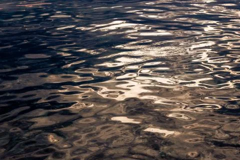 Rippling Water Surface With Sunlight Reflections 스톡 사진