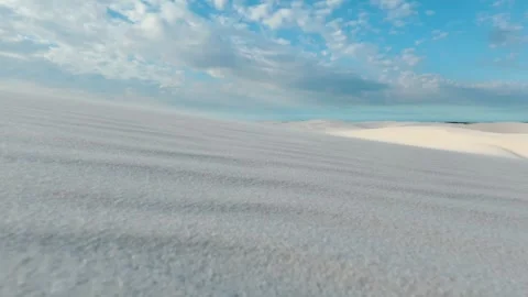 Rippling White Sand Dunes Beneath Clouds in Lençóis Maranhenses Stock Footage 342440739