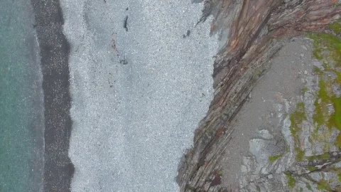 Rise above the pebble beach. Stock Footage 83690276