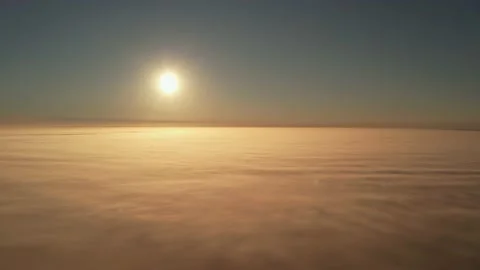Rise above the thick fog until the morning sunrise. Aerial view Stock Footage 204058633