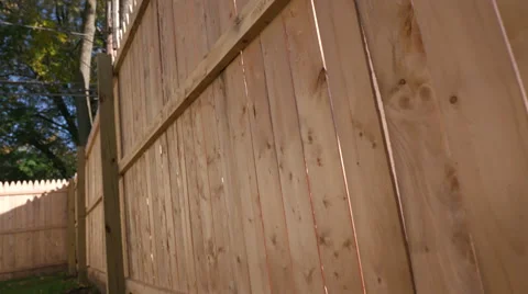 Rise Up and Tilt Down on Close Up of New Fence Stock Footage 68778324
