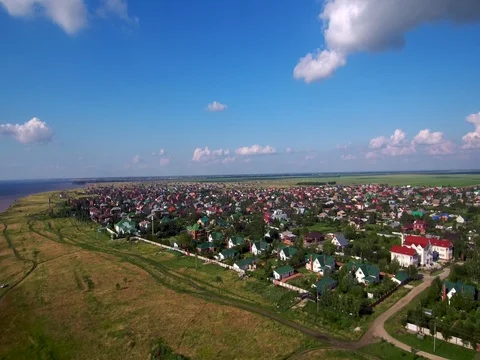 Rise to a height above the settlement. Stock Footage 77763744