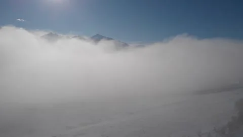 Rise over clouds with mountains in winter Stock Footage 310526944