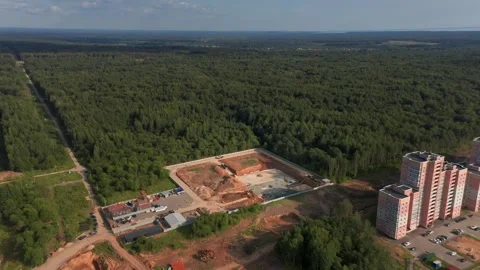 The Rise of Residential Blocks: Construction Dynamics in Urban Forestry Stock Footage 257770960