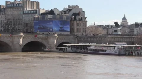 The rise of the Seine River in Paris forces the closure of around fifteen river  Stock Footage 329128692