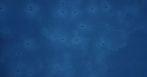 Rising above a deep blue dark frozen lake Video stock 122402218