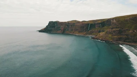 Rising above the landscape where cliffs and rocks meet the ocean - Drone 4k 動画素材 113742807