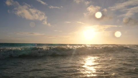 Rising Above Ocean Waves at Sunset Stock Footage 96301265