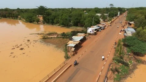 Rising aerial of Koudougou bridge Stock Footage 80361268