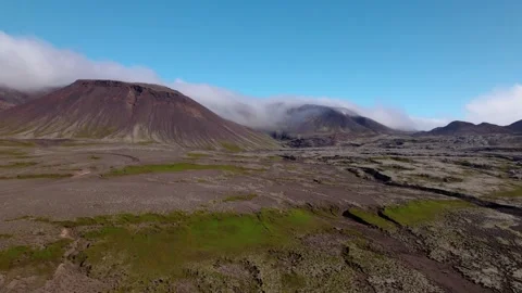 Rising aerial shot over dramatic Iceland landscape of dormant volcano. Video stock 167298732