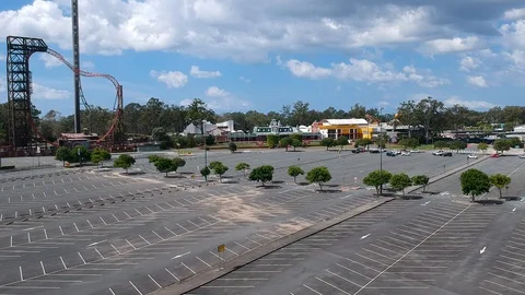 Rising aerial view of an empty Theme Park closed to the public due to the Stock-Footage 128442829